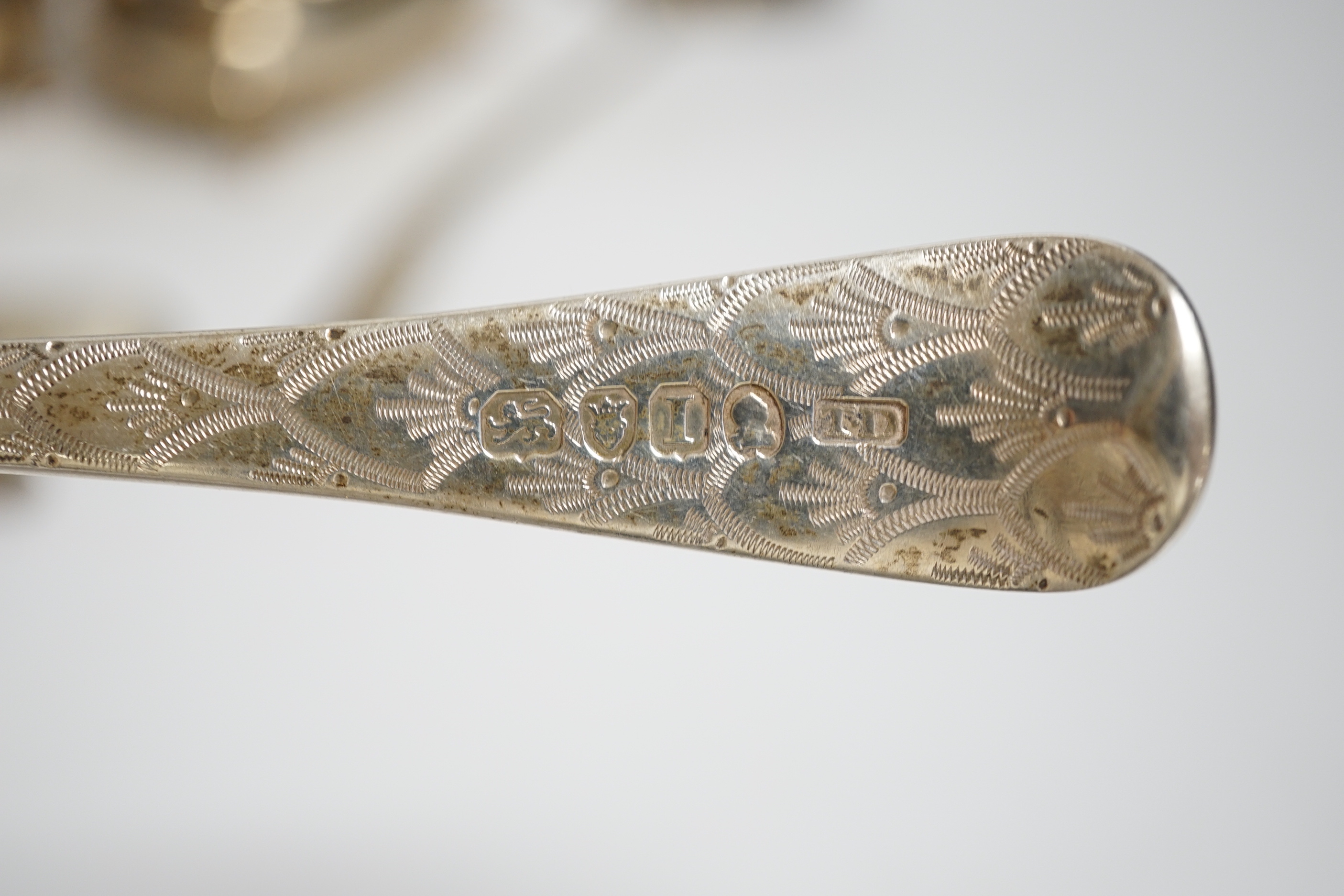 A George VI silver mug, Birmingham, 1937, 11.5cm with engraved inscription to Wing Commander E.E.M Angell, a pair of George III Old English pattern berry spoons, a George IV silver caddy spoons and other items including